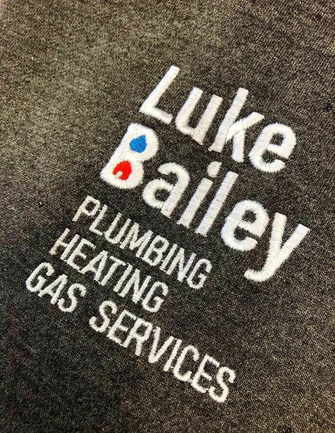 Example of embroidery on charcoal clothing